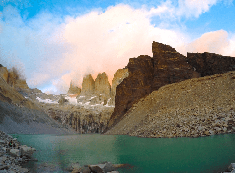Torres del Paine, rocky cliffs and mountains, with a green lake in front